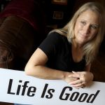 Penny Kellam is the local organizer for a &ldquo;happiness sprinkling,&rdquo; where people stand on street corners with signs such as &ldquo;Live Your Dream&rdquo; and &ldquo;Life is Good.&rdquo; The project is scheduled for a busy Mukilteo intersection (Mukilteo Speedway & Paine Field Way) on Friday.