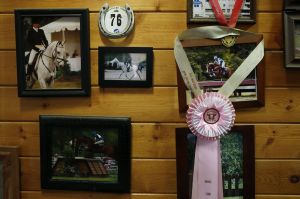 Award medals and photos hang on the wall of Meika Decher and Mark Salser&rsquo;s Polestar Farm in Lochsloy. Decher grew up riding and competing with horses while her husband, Salser, has only worked with them since the couple moved to their property in 2007.