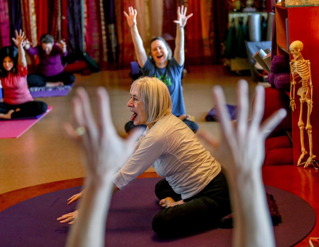 Karen Guzak is not without a sense of humor while leading classes in Yoga. This pose is called &ldquo;lion&rsquo;s breath.&rdquo;