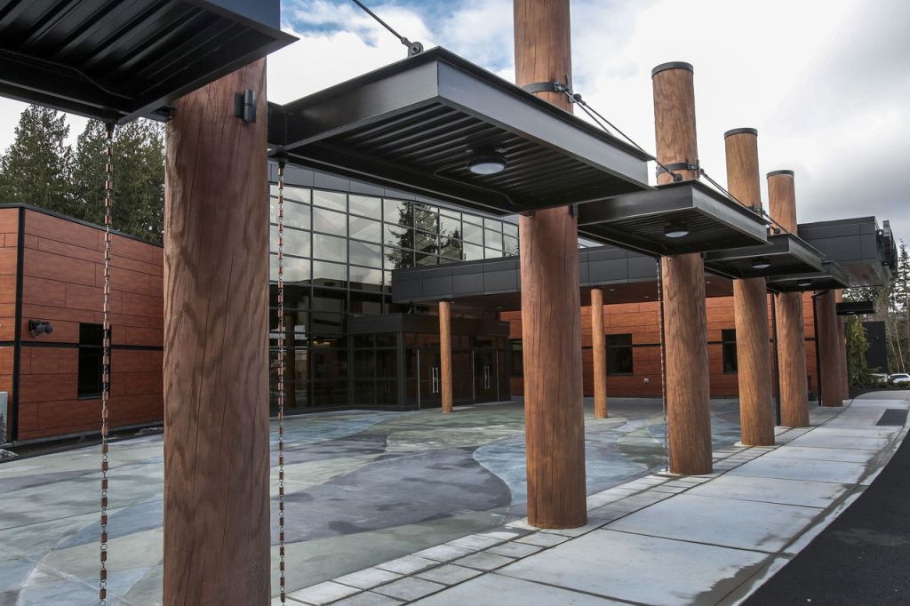 Concrete pillars decorated to look and feel like wood stand tall outside the new administrative building of the Stillaguamish Tribe in Arlington.