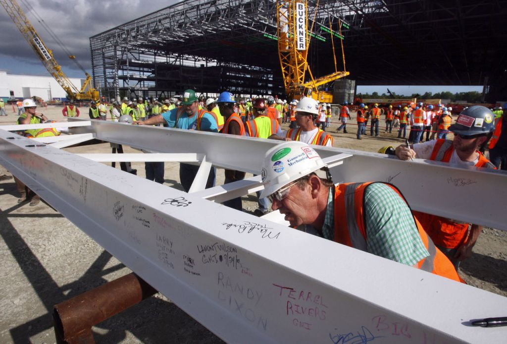 Herman Henson, with other construction workers, sign the last two beams for the new Boeing factory in North Charleston, South Carolina, in 2010.