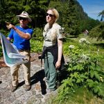 Joe Gibbens and Tracy O&rsquo;Toole, both from the U.S. Forest Service, look over a map showing work to be done to remove hazardous material from the abandoned mining town of Monte Cristo during a walkthrough of the area in June.