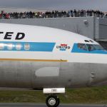 Spectators line the observation deck at the Future of Flight Aviation Center at Paine Field to watch the first Boeing 727 taxi to the runway for its last flight, Everett to the Boeing Field in Seattle on Wednesday.