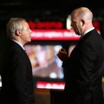 In the Octane Lounge, overlooking a new scoreboard at Xfinity Arena on Wednesday, Snohomish County Council Chairman Terry Ryan (left) talks with Rick Comeau, general manager of Xfinity Arena, after a brief ceremony during which officials gave the arena $250,000 toward the scoreboard.