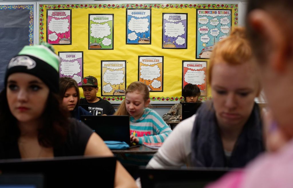 Posters explaining steps for critical thinking on their STEM projects on the wall in a class at Darrington&rsquo;s middle and high School in December 2015. The Darrington STEM pilot project, which started after the mudslide more than a year and a half ago, has grown quickly. It includes an elementary outdoor school, middle school water research and high school coding and programming mentorships.