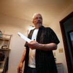 Executive Pastor Dan Hazen holds a list of names that residents can call if they need support as he shows off a residence that will house three men on Thursday in Marysville. Marysville is opening its first home for formerly homeless people, as a pilot project, with only 3 or 4 residents who have been through substance abuse treatment programs, and it&rsquo;s managed jointly with the faith community.