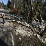 Work begins to reinforce Grade Road and help prevent further erosion caused by nearby Catherine Creek in Lake Stevens on Wednesday. The section of road, near the intersection of Grade Road and 32nd Street Northeast, has been closed for months and won&rsquo;t reopen until later this year.