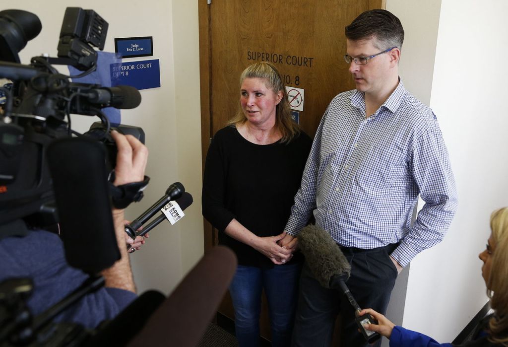 Brenda Welch (center) and Chris Anderson talk to the media after the sentencing of David Morgan on Wednesday at Snohomish County Superior Court.