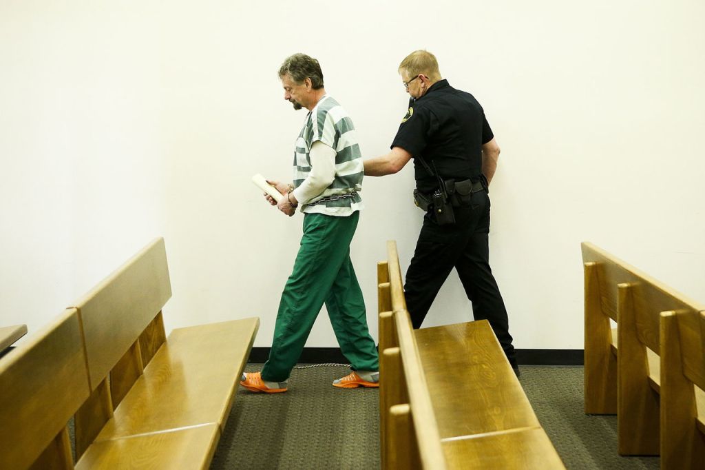 David Morgan is led out of Snohomish County Superior Court on Wednesday in Everett after being sentenced to more than 21 years in prison for the attempted killing of his ex-wife, Brenda Welch, in 2014 at his Lynnwood home.