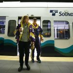 Anne and Jon Nelson, of Seattle, exit a light-rail train at University of Washington Station in Seattle on Saturday. Sound Transit&rsquo;s expansion plans for Everett will be on display Monday at Everett Station.