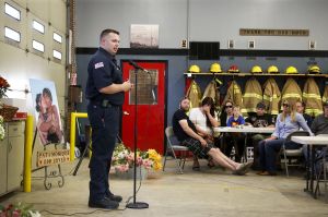 Oso Fire Department Chaplain Joel Johnson speaks at the event.