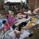 Four families wake up after sleeping outside their homes that collapsed during the earthquake in Manta, Ecuador, on Tuesday. The strongest earthquake to hit Ecuador in decades flattened buildings and buckled highways along its Pacific coast, sending the Andean nation into a state of emergency.