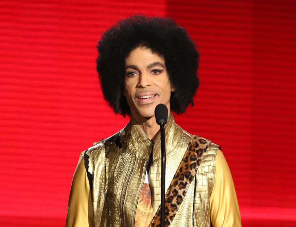 In this Nov. 22, 2015, photo, Prince presents the award for favorite album &mdash; soul/R&B at the American Music Awards in Los Angeles.