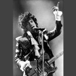 In this Jan. 22, 1985, photo, Prince performs in concert at Riverfront Coliseum during his Purple Rain Tour in Cincinnati, Ohio.