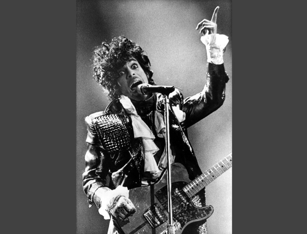 In this Jan. 22, 1985, photo, Prince performs in concert at Riverfront Coliseum during his Purple Rain Tour in Cincinnati, Ohio.