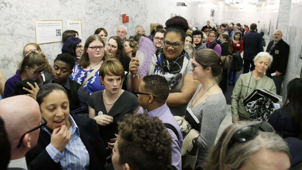 Ted S. Warren / Associated Press People pack a hallway outside a Washington Senate hearing room Wednesday at the Capitol in Olympia as they wait to listen to public testimony regarding a bill that would eliminate Washington&rsquo;s new rule allowing transgender people use gender-segregated bathrooms and locker rooms in public buildings consistent with their gender identity.