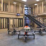 An inmate in the maximum security wing is watches television at the Accountability and Restitution Center (ARC) in Tumwater on Feb. 11. As with the old jail, the new one is overcrowded, and some inmates are still being housed in other counties.
