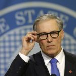 Washington Gov. Jay Inslee listens to a question as he talks to reporters Thursday at the Capitol in Olympia about his office&rsquo;s nearly two-month investigation into the early release of prisoners.