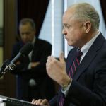 Carl Blackstone (right), one of two former federal prosecutors hired by Gov. Jay Inslee to investigate the early release of prisoners, talks to reporters Thursday at the Capitol in Olympia.