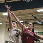 Lynnwood&rsquo;s Mikayla Pivec goes to the basket as Stanwood&rsquo;s Koa Beck defends during the Royals&rsquo; 63-24 win over the Spartans in a 3A District 1 semifinal on Wednesday.