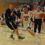 Kamiak&rsquo;s Gavin Patrick (23) drives past Jackson&rsquo;s Sam Saufferer during a 4A District 1 tournament game Saturday at Everett Community College. Kamiak won 62-58.