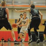Kamiak&rsquo;s Carson Tuttle (3) looks to pass as Jackson&rsquo;s Connor Marschall (20) and Ian Willgress (10) defends during a 4A District 1 tournament game Saturday at Everett Community College. Kamiak won 62-58.