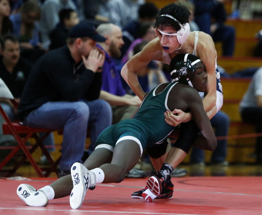 Edmonds-Woodway&rsquo;s Ebrima Fatty (left) takes down Everett&rsquo;s Stephan Erosa on his way to winning the 113-pound title match at the 3A regionals Saturday at Marysville Pilchuck High School.