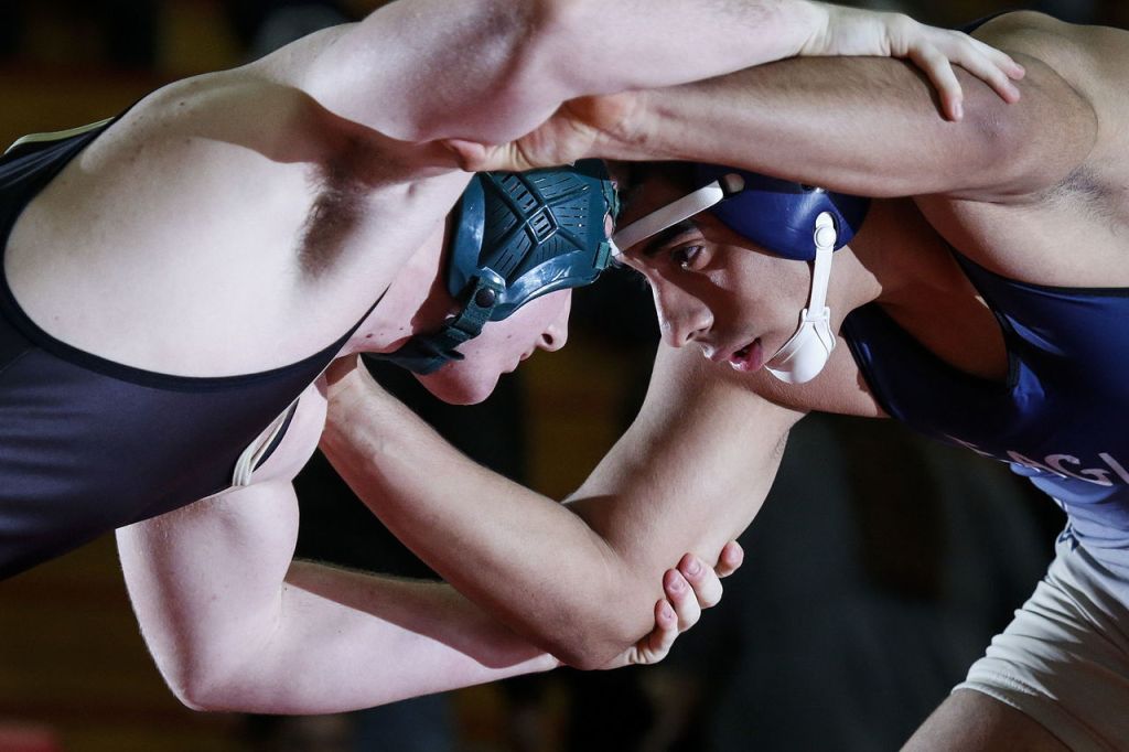 Marysville Getchell&rsquo;s Troy Woodruff (left) goes head to head against Arlington&rsquo;s Adalberto Ramos on his way to winning the 220-pound title match at the 3A regionals Saturday at Marysville Pilchuck High School.