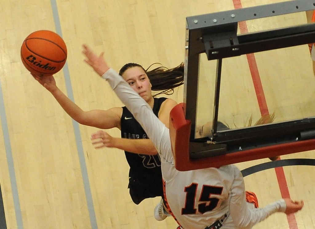 Lake Stevens&rsquo; Kristen Glick shoots over Monroe&rsquo;s Jadynn Alexander during a 4A District 1 playoff game Saturday at Everett Community College.