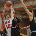 Marysville Pilchuck guard Josiah Gould (12) shoots a layup past Ferndale&rsquo;s Garett Holmes (5) during a 3A District 1 playoff game on Friday in Marysville.