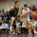 DOUG RAMSAY / FOR THE HERALD Marysville Pilchuck guard Josiah Gould drives the baseline past Ferndale&rsquo;s Dane Larsen during a 3A District 1 playoff game on Friday in Marysville.
