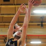 Marysville Pilchuck post Nate Heckendorf (back side) reaches for a rebound along with Ferndale&rsquo;s Sky Freeman (2) during a 3A District 1 playoff game on Friday in Marysville.