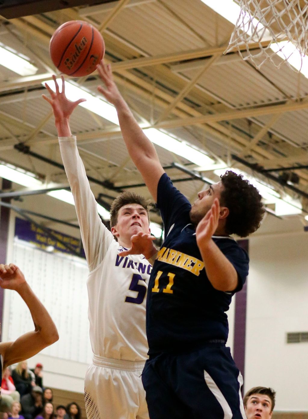 Lake Stevens&rsquo; Wyatt Wahlberg attempts a shot over Mariner&rsquo;s Swell Ewing Thursday night in Lake Stevens.
