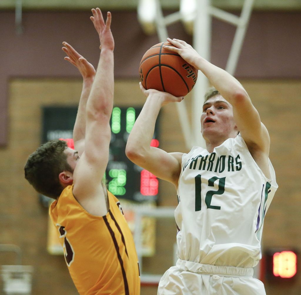 Edmonds-Woodway&rsquo;s Noah Becker (12) takes a jump shot during a 3A state regional game against O&rsquo;Dea on Saturday at Mountlake Terrace High School.