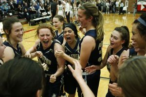 Arlington&rsquo;s (from left) Selena Gutierrez, Kelsey Mellick, Serafina Balderas, Tahlia Miears and Sevi Bielser celebrate their 49-30 victory over Bishop Blanchet in a 3A state regional game on Saturday at Mountlake Terrace High School.