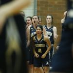 Arlington&rsquo;s Serafina Balderas (center) reacts to a basket with fellow teammates during a 3A state regional game against Bishop Blanchet on Saturday at Mountlake Terrace High School.