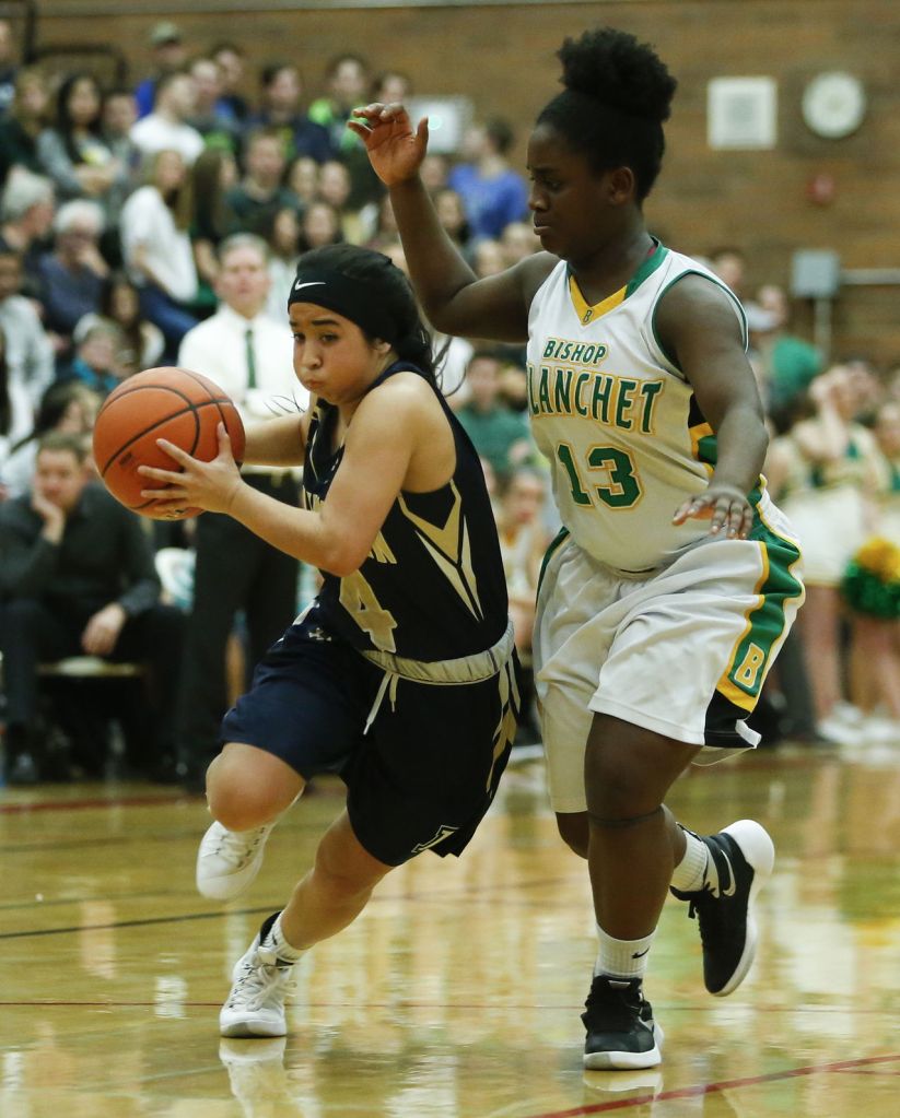 Arlington&rsquo;s Serafina Balderas (left) drives past Bishop Blanchet&rsquo;s Taylor Chambers during a 3A state regional game on Saturday at Mountlake Terrace High School.