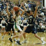 Bishop Blanchet&rsquo;s Lee Erickson (23) tries to find an open player to pass to as Arlington&rsquo;s Peyton Brown (14) and Gracie Castaneda (3) pressure her during a 3A state regional game on Saturday at Mountlake Terrace High School.