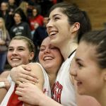 Members of the Snohomish girls basketball team celebrate their 53-40 victory over Gig Harbor in a 4A state regional game on Saturday at Everett Community College.