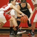 Snohomish&rsquo;s Shaylee Harwood (left) and Gig Harbor&rsquo;s Hannah Carroll battle for control of a loose ball during the Panthers&rsquo; 53-40 win in a 4A state regional game Saturday at Everett Community College.