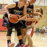 Gig Harbor&rsquo;s Maddie Willett (left) Gig Harbor&rsquo;s Abby Nordquist and Snohomish&rsquo;s Shaylee Harwood fight for a rebound Saturday night during the Panthers&rsquo; 53-40 win in a 4A state regional game at Everett Community College.
