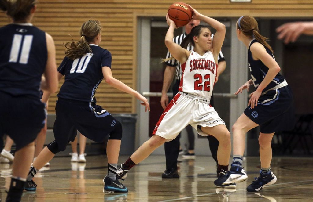 Snohomish&rsquo;s Shaylee Harwood passes against Gig Harbor&rsquo;s press during the Panthers&rsquo; 53-40 win Saturday night in a 4A state regional game at Everett Community College.