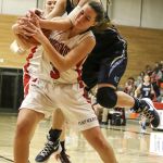 Snohomish&rsquo;s Katie Brandvold and Gig Harbor&rsquo;s Sydney Bertholf struggle for a rebound Saturday night during the Panthers&rsquo; 53-40 win in a 4A state regional game at Everett Community College.