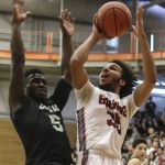 Cascade&rsquo;s Isaiah Gotell attempts a shot over Kentwood&rsquo;s Davonte Sanchez during a 4A state regional game on Saturday at Everett Community College.