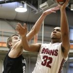 Cascade&rsquo;s Brennen Hancock attempts a shot over Kentwood&rsquo;s Beau Roggenbach during a 4A state regional game on Saturday at Everett Community College.