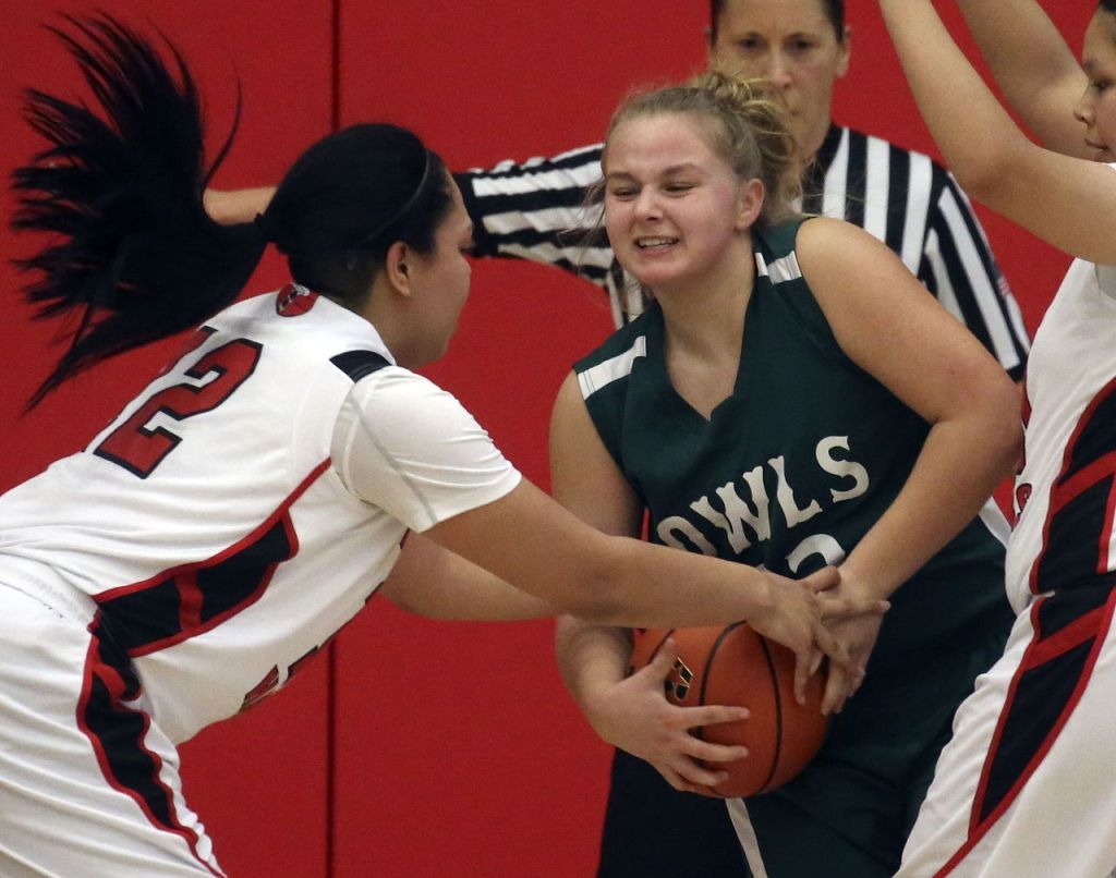 Tulalip Heritage&rsquo;s Adiya Jones reaches in on Mary M. Knight&rsquo;s Mary Koonrad during a 1B state regional game Saturday at Everett Community College. Tulalip Heritage won 54-42.