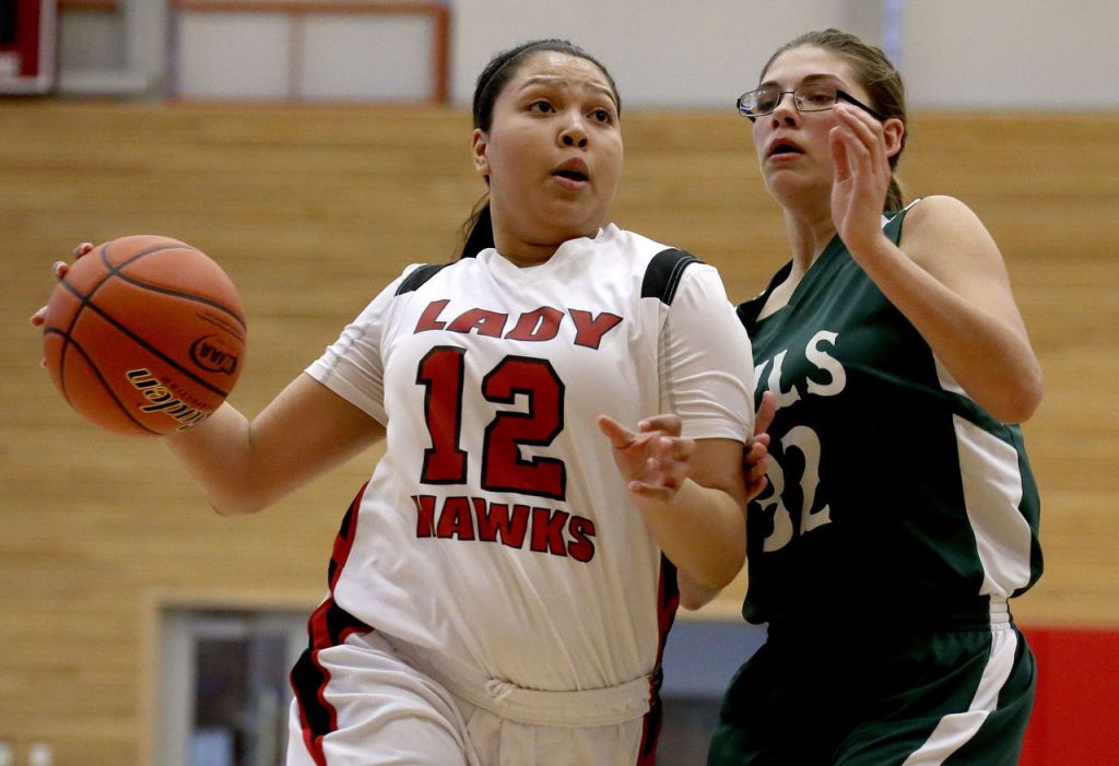 Tulalip Heritage&rsquo;s Adiya Jones drives to the basket with Mary M. Knights&rsquo; Jadyn Davidson defending during a 1B state regional game Saturday at Everett Community College. Tulalip Heritage won 54-42.