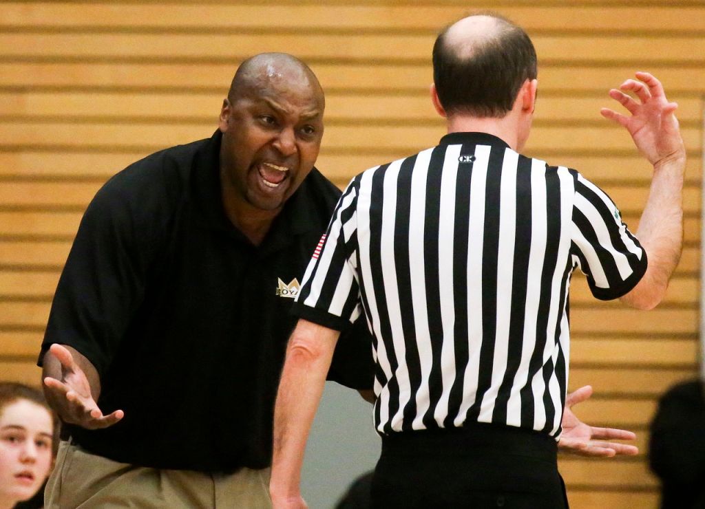 Lynnwood head coach Everett Edwards argues a call during a 3A state regional game against West Seattle on Saturday afternoon at Everett Community College. Lynnwood won 59-34.