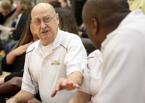 Lynnwood assistant coach Wayne Edwards talks with head coach Everett Edwards during a 3A playoff game on Feb. 17 at Shorecrest High School.