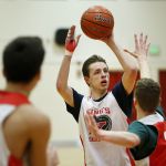 King&rsquo;s Josh Frohardt (center) takes a shot during practice for the state quarterfinals at King&rsquo;s High School on Tuesday.